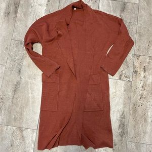 Long burnt orange sweater, size large